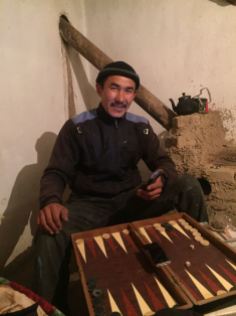My host, on the border, trying to teach me Backgammon... in Russian